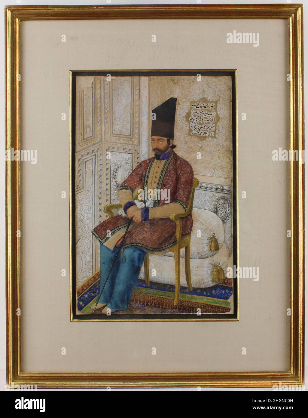 Portrait of `Ali Quli Mirza, I`tizad al-Saltana dated A.H. 1273/A.D. 1856–7 Abu`l Hasan Ghaffari, known as Sani' al-Mulk This fine portrait of prince 'Ali Quli Mirza I'tizad al-Saltana 54th son of the ruler Fath 'Ali Shah Qajar, Minister of Higher Education, and Director of the Dar al-Funun academy (Iran's first modern insitution of higher learning). It demonstrates the court artist Abu'l Hasan Ghaffari's extraordinary skills in rendering naturalistic portraits that capture the sitter's psychological state. Here, the artist has devoted attention to a lavishly decorated interior of carved plast Stock Photo